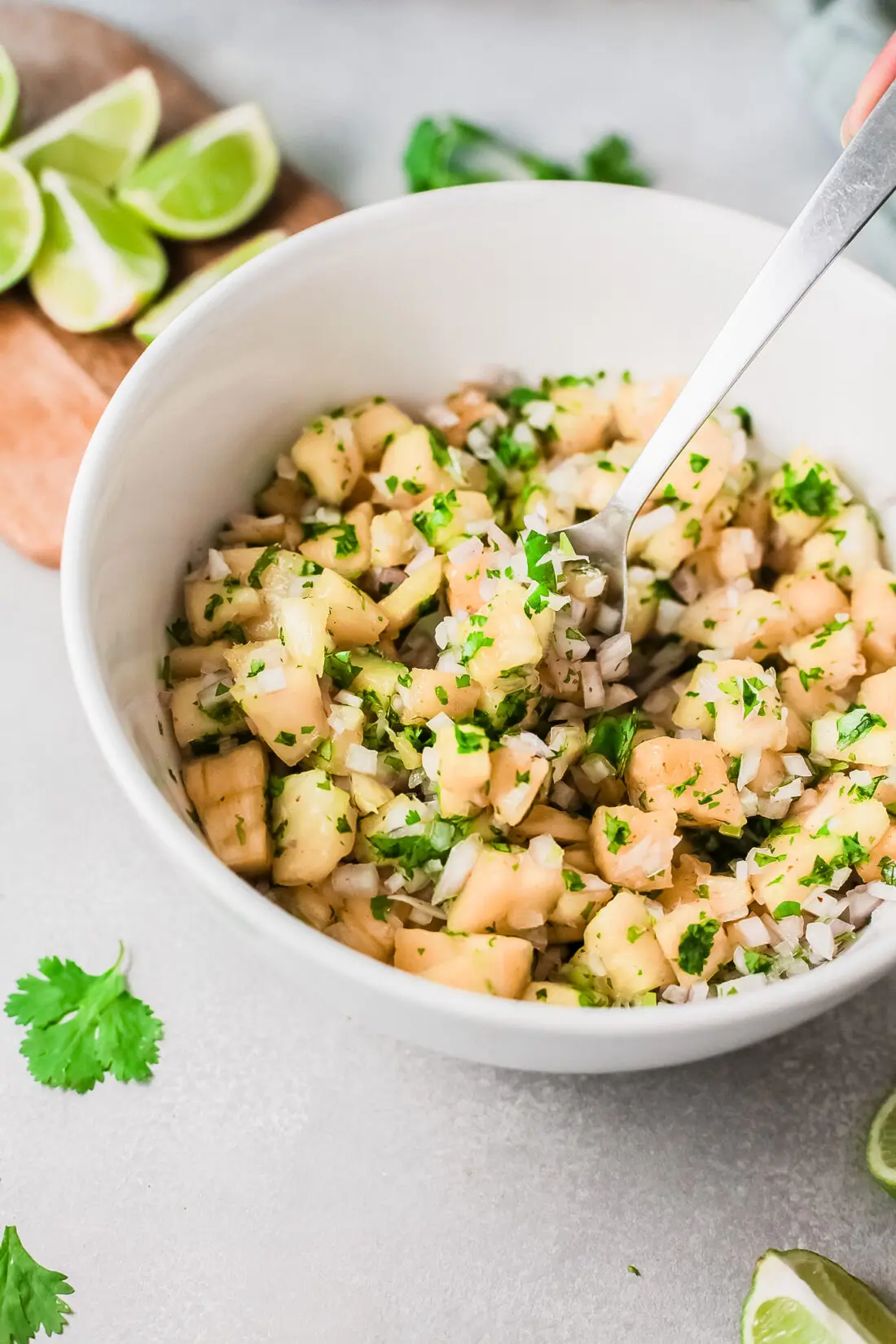 A fresh and simple pineapple salsa recipe that goes great with tacos and tortilla chips. Made with fresh-cut pineapple, peppers, onions, lime juice, and cilantro. It's an easy-to-make dip recipe that pairs well with other summertime recipes.