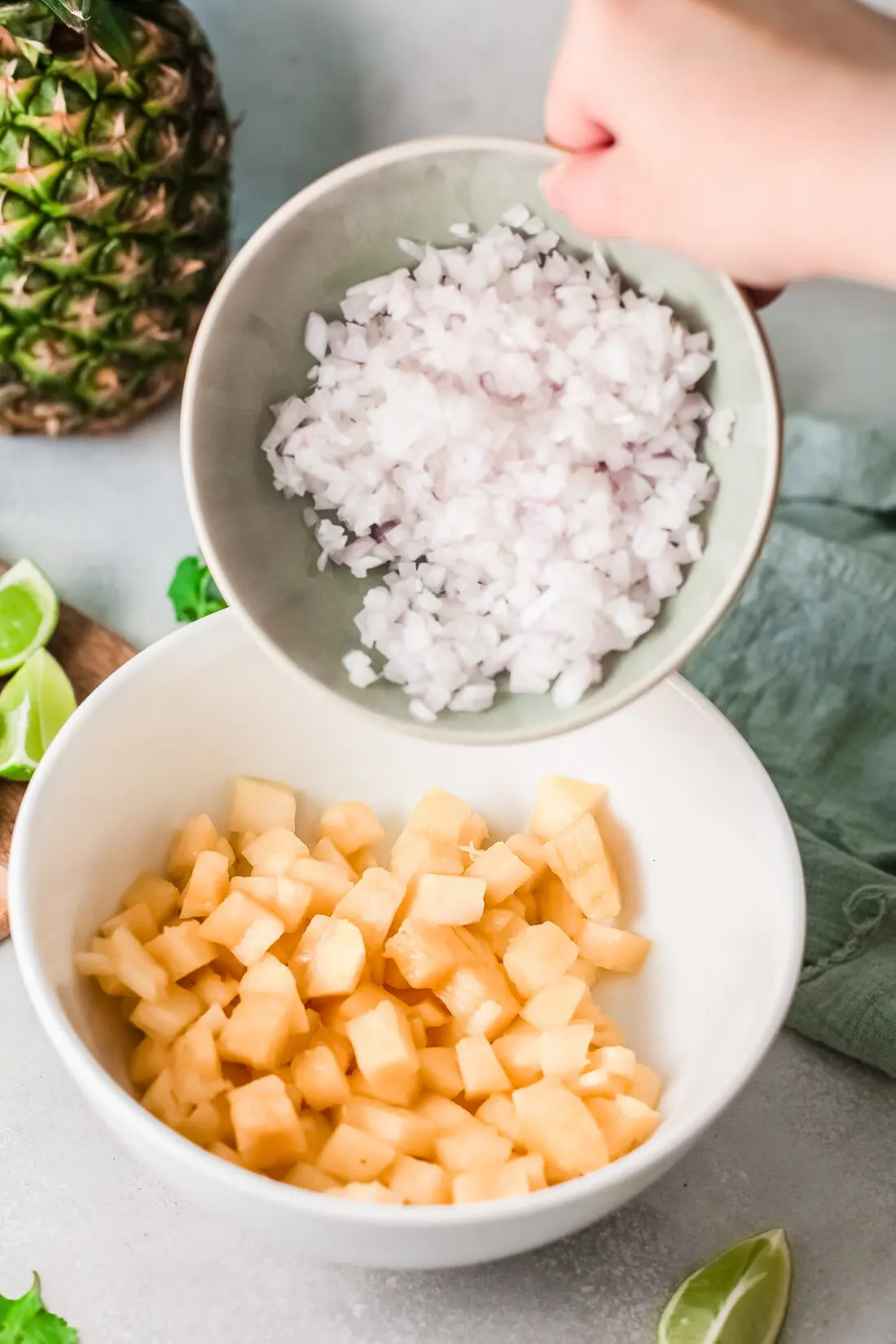 A fresh and simple pineapple salsa recipe that goes great with tacos and tortilla chips. Made with fresh-cut pineapple, peppers, onions, lime juice, and cilantro. It's an easy-to-make dip recipe that pairs well with other summertime recipes.