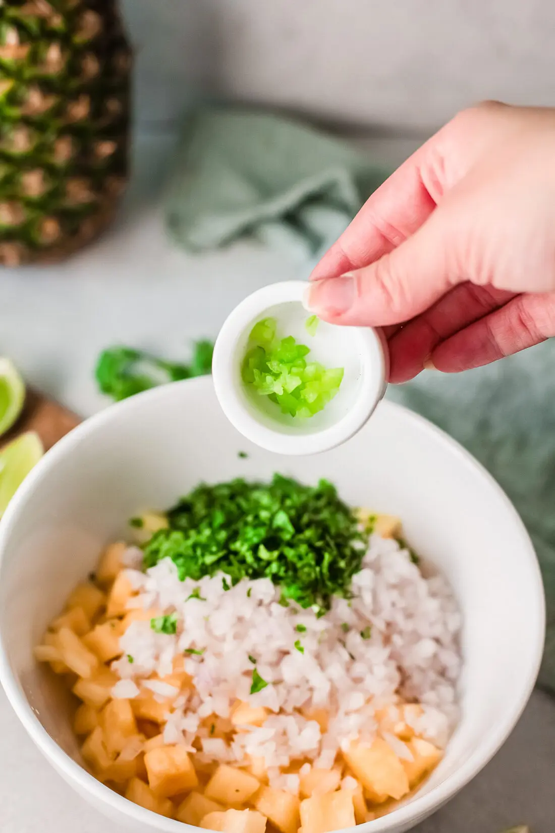 A fresh and simple pineapple salsa recipe that goes great with tacos and tortilla chips. Made with fresh-cut pineapple, peppers, onions, lime juice, and cilantro. It's an easy-to-make dip recipe that pairs well with other summertime recipes.