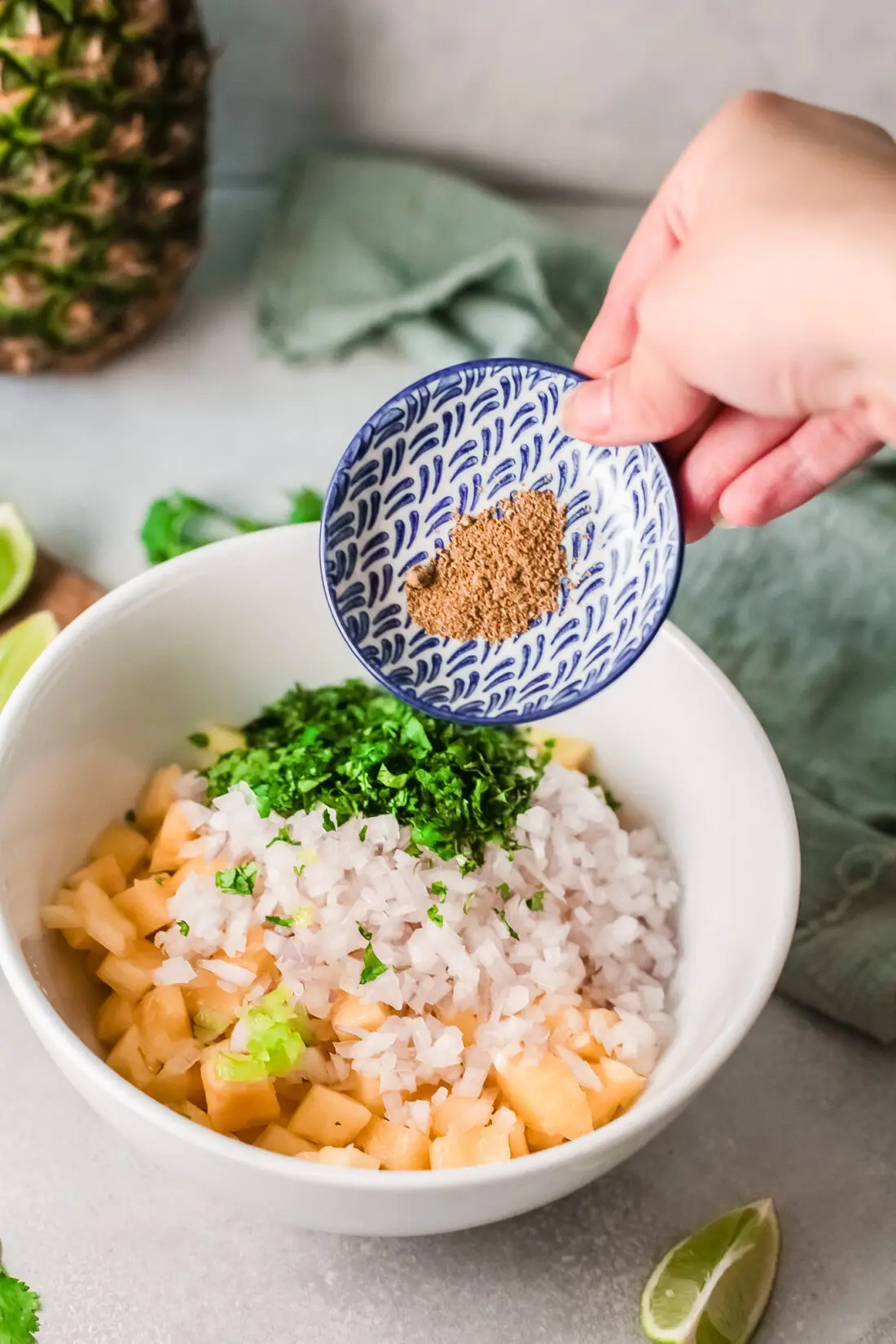 A fresh and simple pineapple salsa recipe that goes great with tacos and tortilla chips. Made with fresh-cut pineapple, peppers, onions, lime juice, and cilantro. It's an easy-to-make dip recipe that pairs well with other summertime recipes.