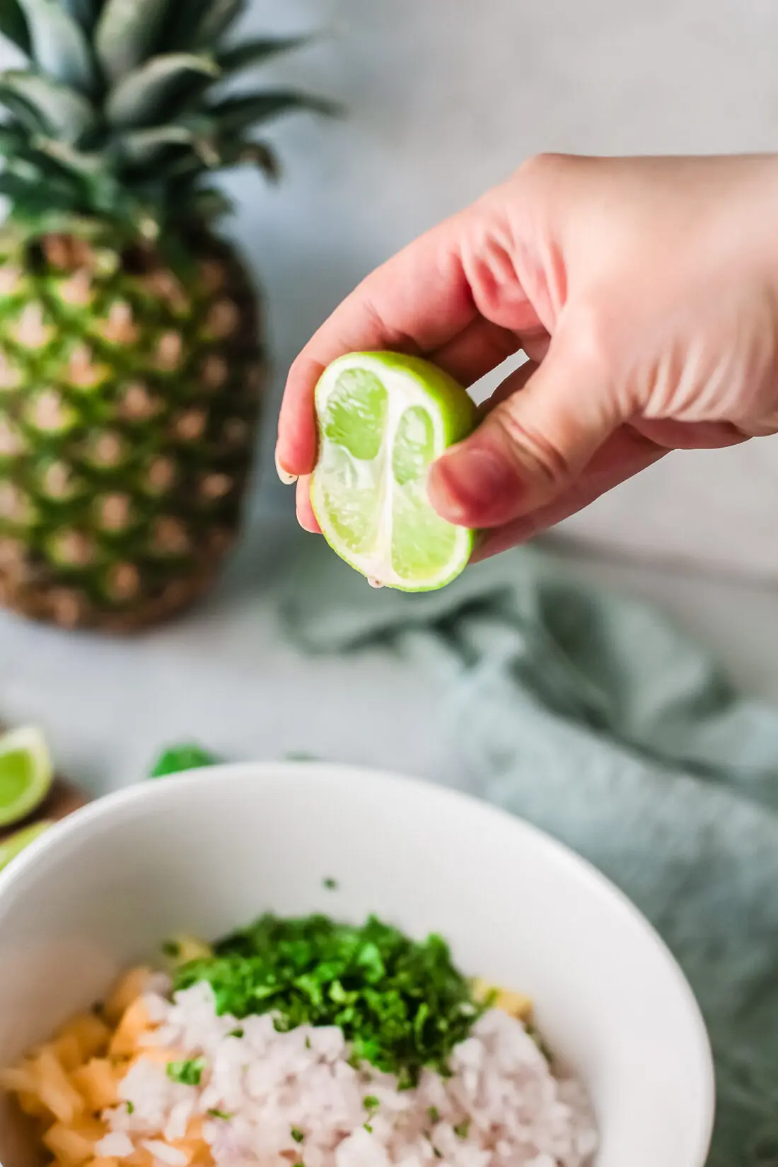 A fresh and simple pineapple salsa recipe that goes great with tacos and tortilla chips. Made with fresh-cut pineapple, peppers, onions, lime juice, and cilantro. It's an easy-to-make dip recipe that pairs well with other summertime recipes.