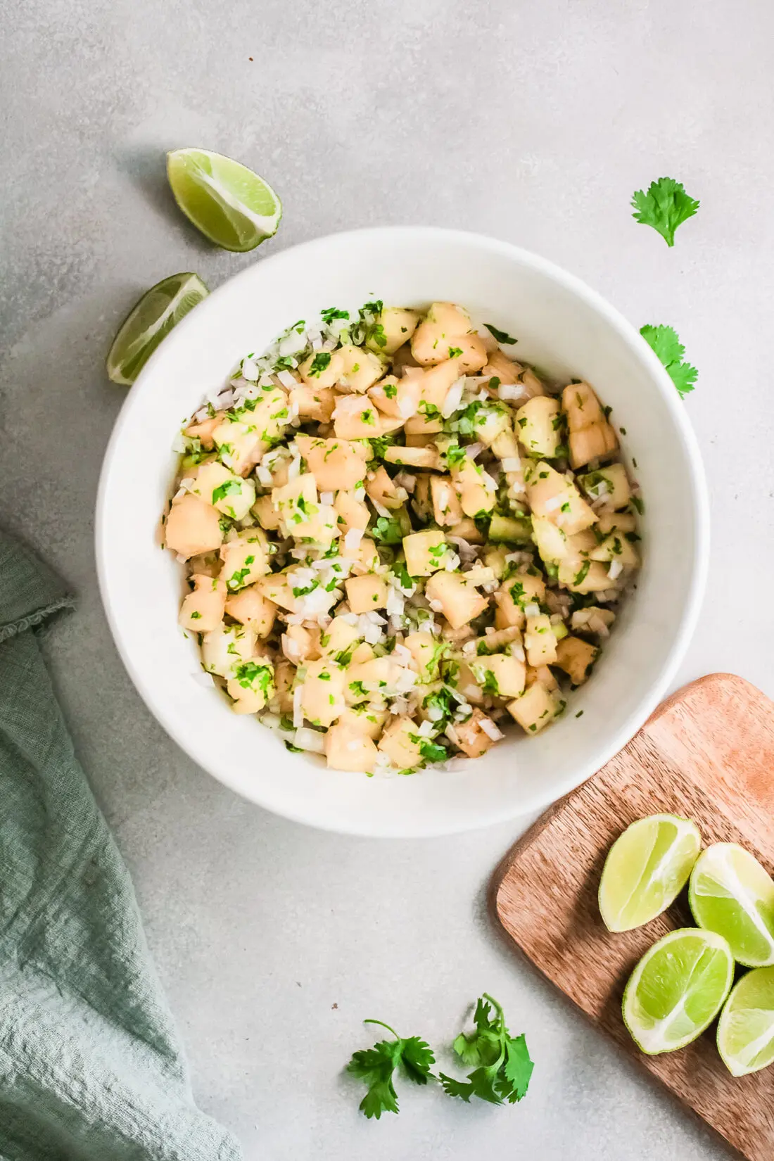 A fresh and simple pineapple salsa recipe that goes great with tacos and tortilla chips. Made with fresh-cut pineapple, peppers, onions, lime juice, and cilantro. It's an easy-to-make dip recipe that pairs well with other summertime recipes.