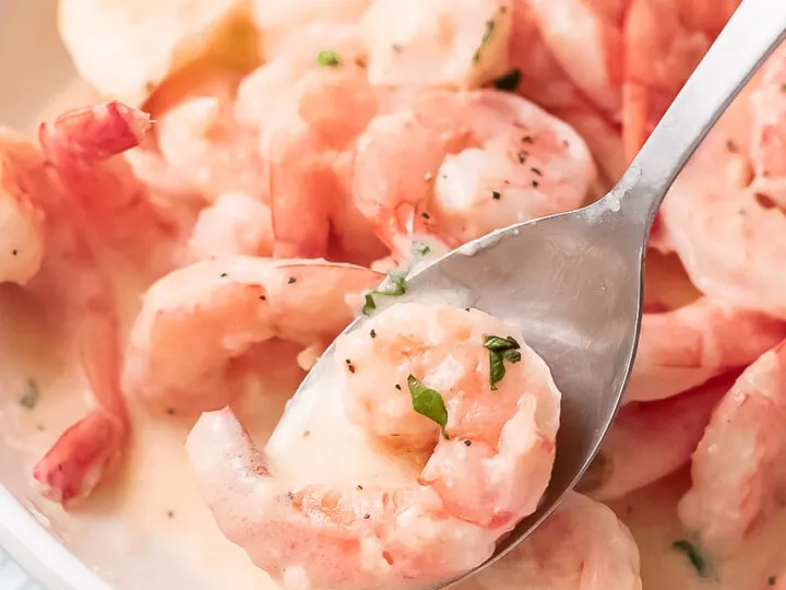 Creamy garlic parmesan shrimp is the perfect weeknight dinner recipe. Ready in just minutes, this quick and easy shrimp recipe goes great with a fresh salad or on top of your favorite pasta.