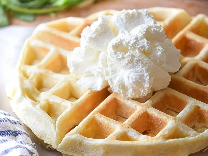 These Cream Cheese Waffles are the perfect homemade waffle recipe for busy morning breakfasts. Deliciously sweet, soft, and fluffy, served with fresh berries, maple syrup, or strawberry syrup.