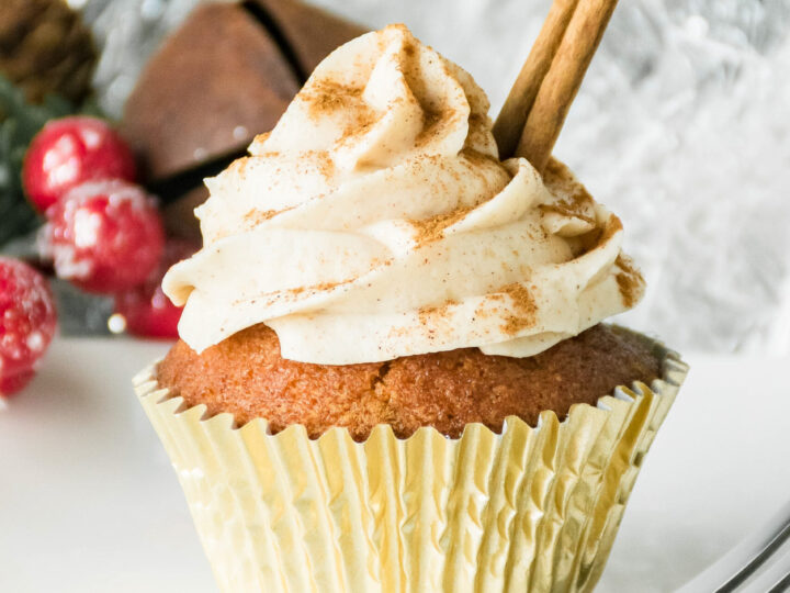 Fluffy and moist Eggnog Cupcakes topped with a creamy eggnog buttercream frosting. These soft and tender eggnog cupcakes and eggnog frosting are made with spiced rum. It's the perfect Christmas cupcake recipe.