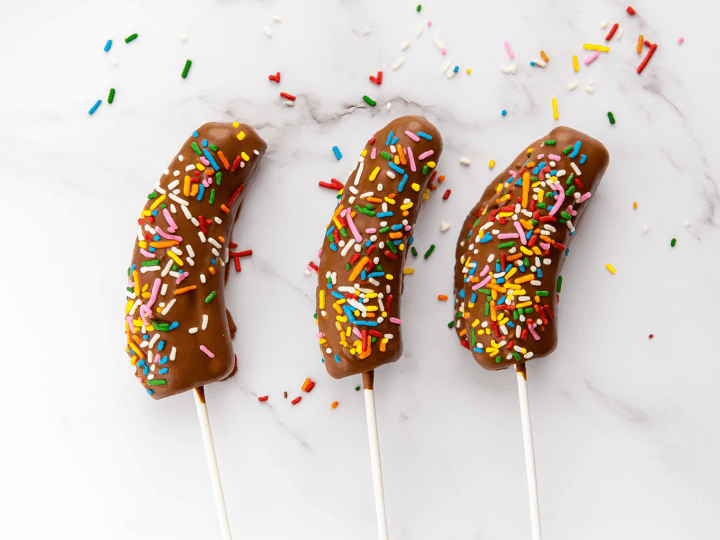 These Chocolate Dipped Bananas are an easy afterschool snack that kids love! This fun and kid friendly snack recipe takes just minutes to make and is perfect for busy afternoons, playdates, or a sweet treat anytime.