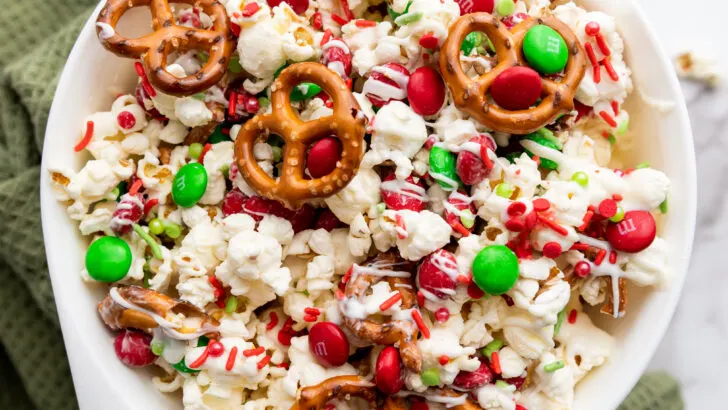 This Christmas Popcorn Snack Mix is the ultimate merry treat, packed with sweet candy melts, crunchy pretzels, festive M&Ms, and just the right sprinkle of holiday magic. It's colorful, crunchy, and completely addictive! Perfect for holiday parties or for everyday snacking.