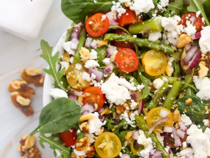 A fresh and easy Spring Salad Recipe! This Asparagus Salad With Goat Cheese is a healthy recipe that&rsquo;s perfect for holidays, potlucks, or dinner.